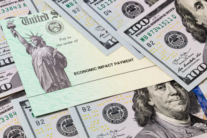 Economic,Impact,Stimulus,Treasury,Check,And,100,Dollar,Bills.,Concept