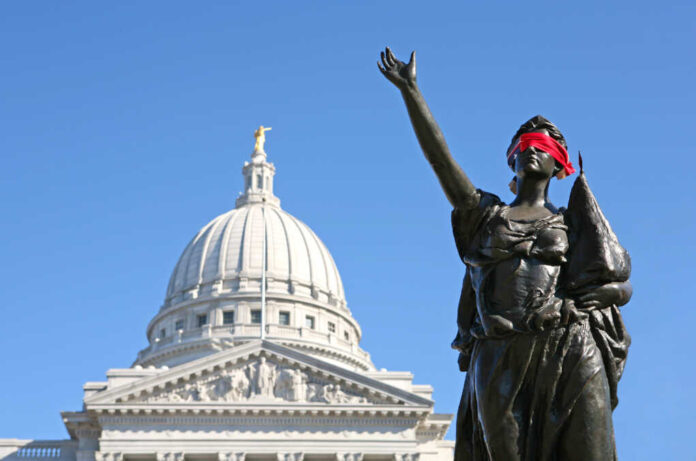 Blindfolded,Statue,Outside,Of,Madison,,Wisconsin,Capitol,Building,,Symbolizing,Oppression.