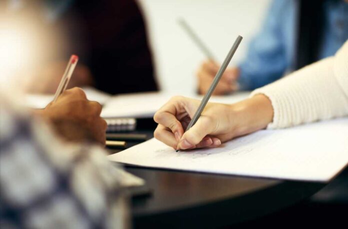 Writing,,Notebook,And,Hands,Of,Person,In,Study,Group,For