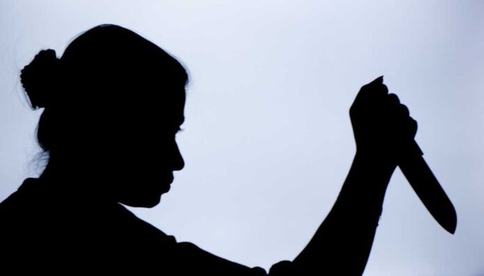 Shadow,Of,A,Woman,With,Knife,In,Hand,With,Suspicious