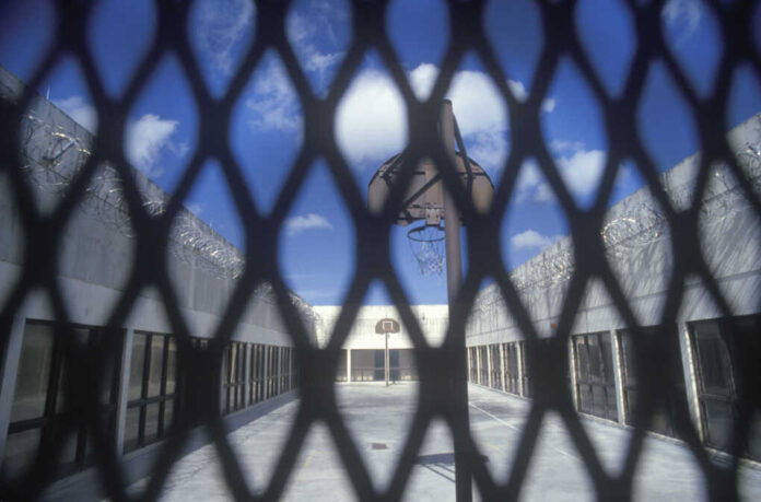 Circa,2002,-,View,Through,Wire,Mesh,Of,Basketball,Court,