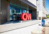 Exterior view of the CNN headquarters with a large red logo