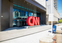 Exterior view of the CNN headquarters with a large red logo