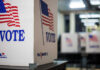 Voting booths with American flags in a polling station