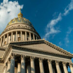 Close-up view of the dome of the West Virginia State Capitol against a blue sky