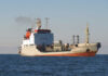 A cargo ship sailing on the ocean