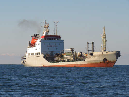 A cargo ship sailing on the ocean