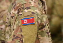 Close-up of a military uniform featuring the North Korean flag