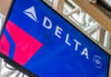 Delta Airlines logo displayed on an airport screen