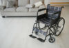 A wheelchair with plaid fabric in a living room setting