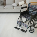 A wheelchair with plaid fabric in a living room setting
