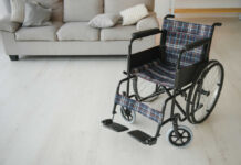 A wheelchair with plaid fabric in a living room setting