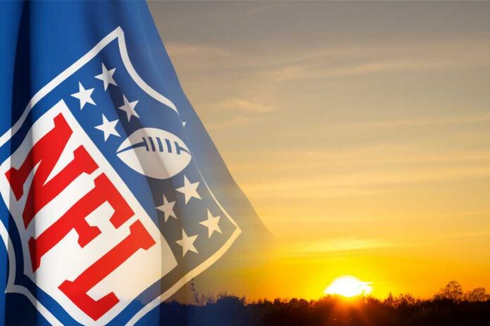 shutterstock_2304735895.jpg NFL logo overlaying a vibrant sunset