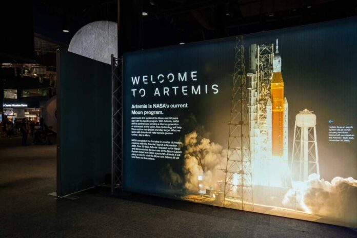 Exhibition display welcoming visitors to the Artemis program with a rocket image