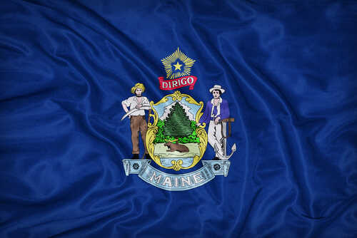 shutterstock_272058554 (1).jpg Maine state flag featuring its coat of arms on a blue background