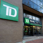 Exterior view of TD Bank with a sign indicating it is open 7 days