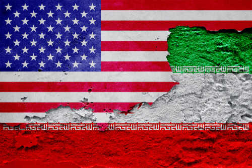 A textured wall featuring the flags of the USA and Iran
