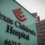 Texas Children's Hospital sign in front of modern buildings