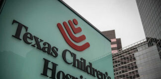 Texas Children's Hospital sign in front of modern buildings