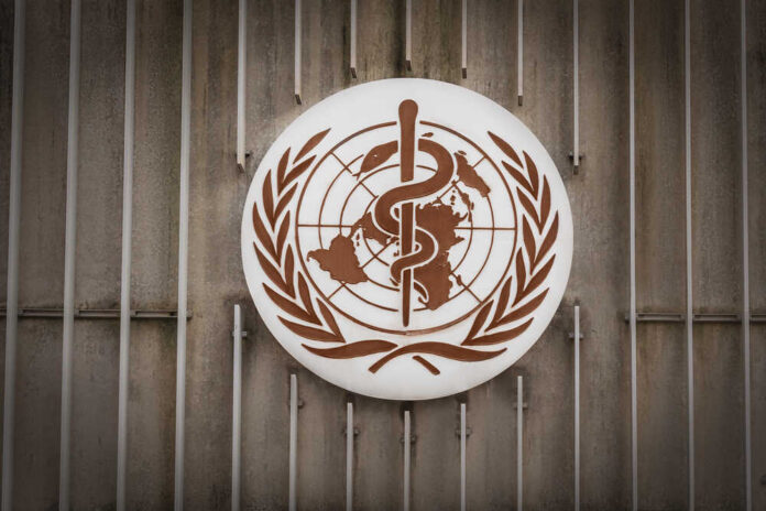 shutterstock_1691653948.jpg World Health Organization emblem featuring a globe and caduceus
