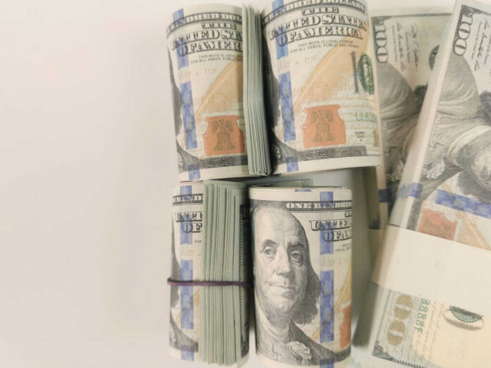 Stacks of hundred dollar bills arranged neatly