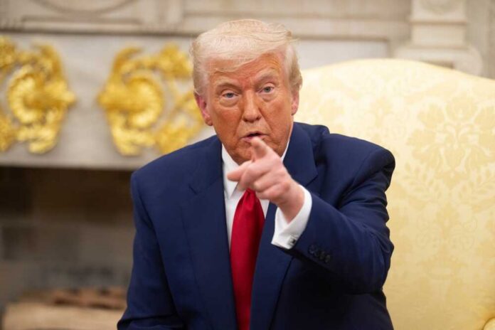 Washington,D.c.,,Usa,-,April,7,,2025:,United,States,President A man in a blue suit and red tie pointing while seated