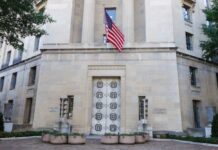 Blueprints Found? Ivanka Hit Scheme Facade of a government building featuring the American flag and decorative entrance