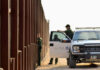 Trump’s $70B Border Gambit U.S. Customs and Border Protection officers near a border fence