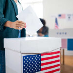 Ballot Crackdown Looms — States Move Fast A person casting a vote into a ballot box at a polling station