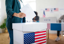 Ballot Crackdown Looms — States Move Fast A person casting a vote into a ballot box at a polling station