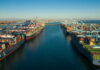 Aerial view of cargo ships docked at a shipping port