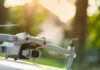Drone Sting Nabs Twice-Deported Cocaine Convict Close-up of a drone with a camera, set against a blurred outdoor background
