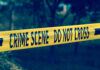 Garden Horror Stuns Poland Yellow crime scene tape reading DO NOT CROSS
