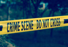 Garden Horror Stuns Poland Yellow crime scene tape reading DO NOT CROSS