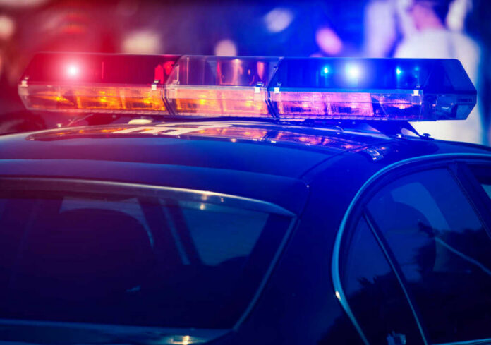 shutterstock_1823442731-1 Close-up of a police cars emergency lights