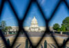 Election Cash Bombshell: CEO Pleads The Fifth View of the U.S. Capitol building through a security fence
