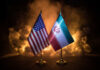 Vance’s Swiss Whiplash Stuns Washington Flags of the United States and Iran displayed together