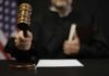 Judge SLAPS Trump Over Park Censorship A judge holding a gavel in a courtroom setting