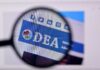 Laptop Shock: Truth Buried, Timing Weaponized Magnified view of a website header featuring the acronym 'DEA' and social media icons
