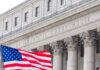 SCOTUS Smacks Down Trump’s Citizenship Gambit Facade of a United States courthouse with an American flag in the foreground