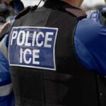 Courthouse Arrests BANNED — ICE Sidelined Close-up of a police officer's vest with 'POLICE ICE' label