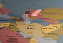 Voters Revolt: End Iran War Now A map highlighting Iran with a small American flag pin