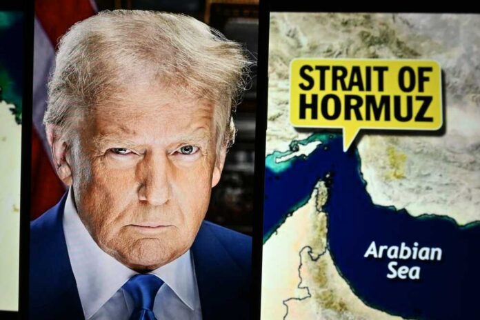 U.s.,President,Donald,Trump,Appears,On,Screen,,With,The,Strait A political figure next to a map highlighting the Strait of Hormuz