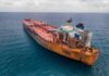 Coast Guard Chase Exposes Ghost Fleet Aerial view of a large, rusty oil tanker in the ocean