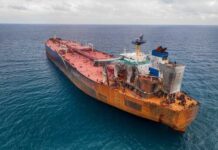 Coast Guard Chase Exposes Ghost Fleet Aerial view of a large, rusty oil tanker in the ocean