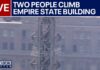 Masked Duo Hijack The Empire State Icon LIVE: People climb to top of Empire State Building spire for flag-raising proposal
