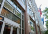 Washington’s Time Bomb: Benefits Axed 22% Exterior view of the United States Social Security Administration building with flags