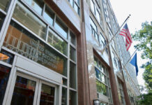Washington’s Time Bomb: Benefits Axed 22% Exterior view of the United States Social Security Administration building with flags
