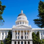Hospitals Exposed: Retroactive Claims Unleashed State capitol building with white dome and columns framed by trees