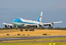 Taxpayers Fume: Air Force One Quagmire Airplane landing on runway with landing gear extended